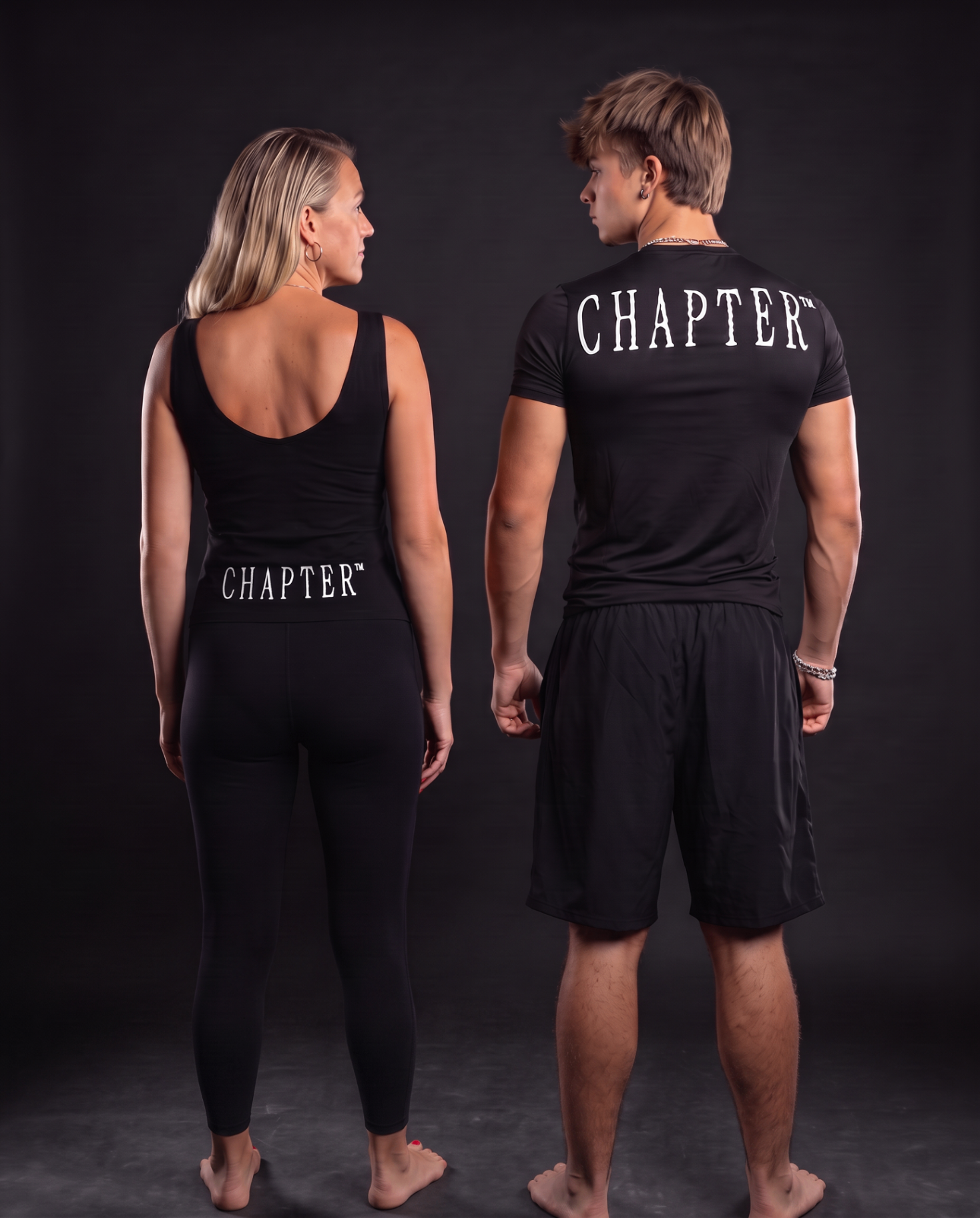 Nichola and Lucas from behind wearing the black CHAPTER™ kit