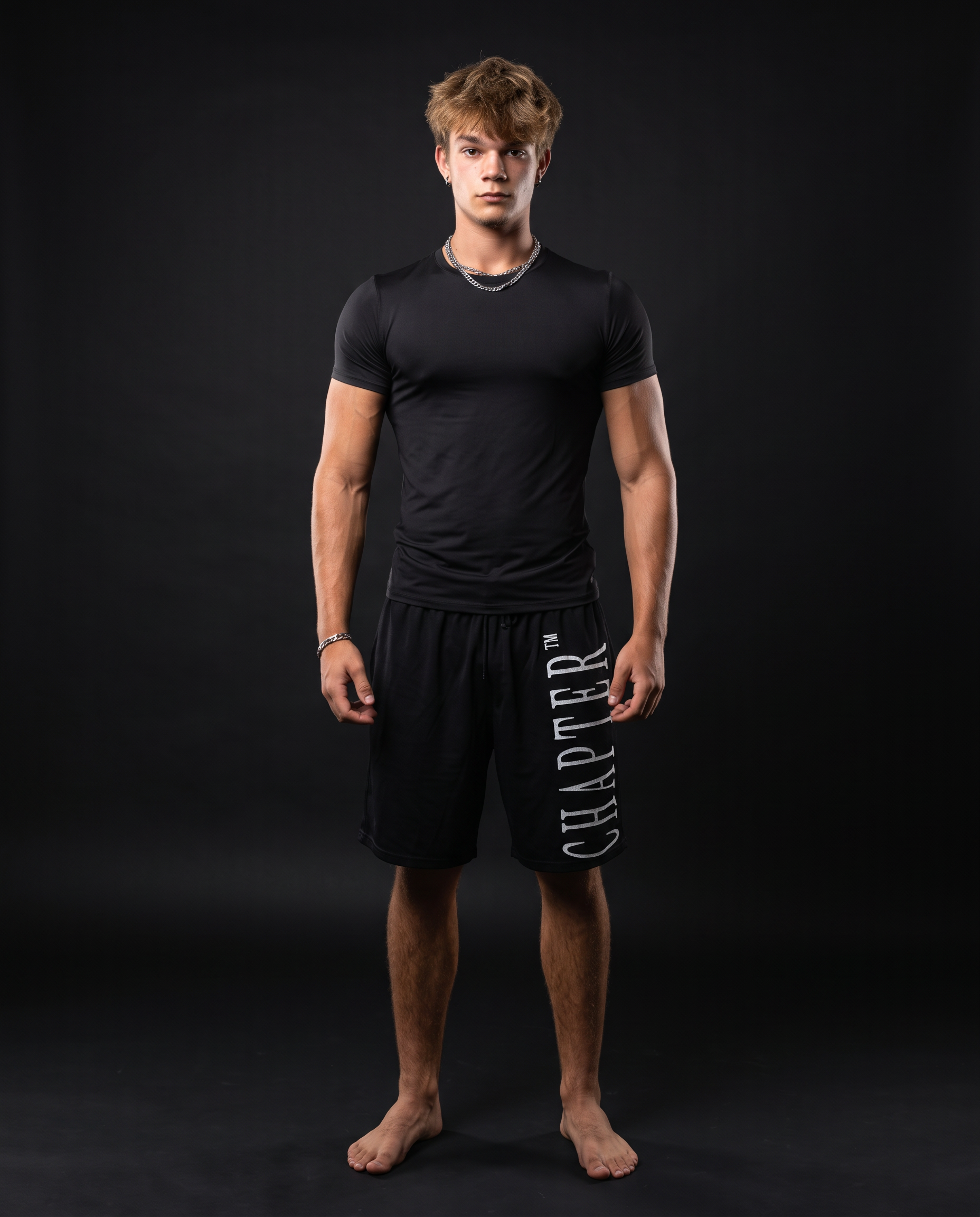 Lucas wearing the black CHAPTER™ T-shirt and shorts, front view