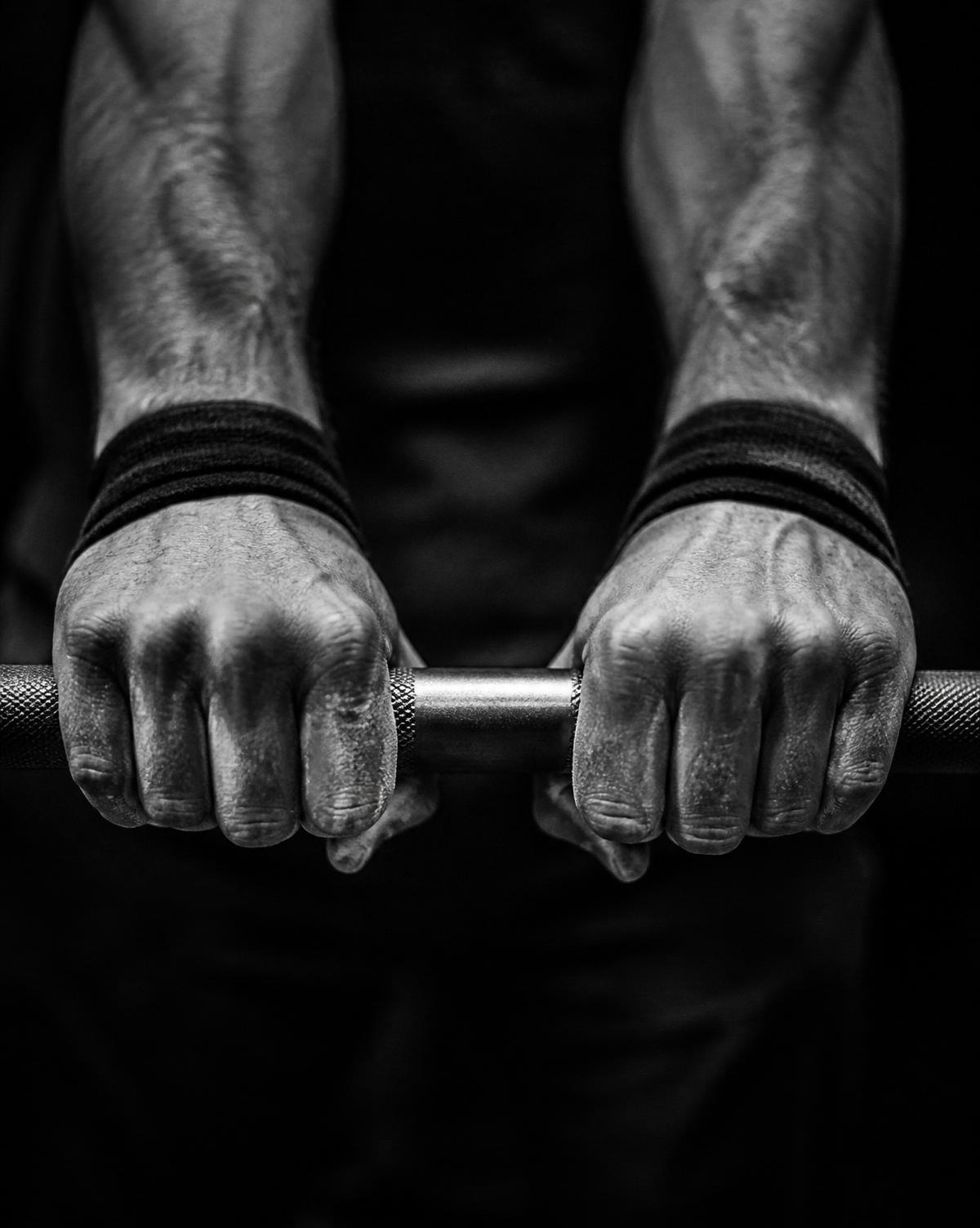 Hands gripping a barbell — the beginning